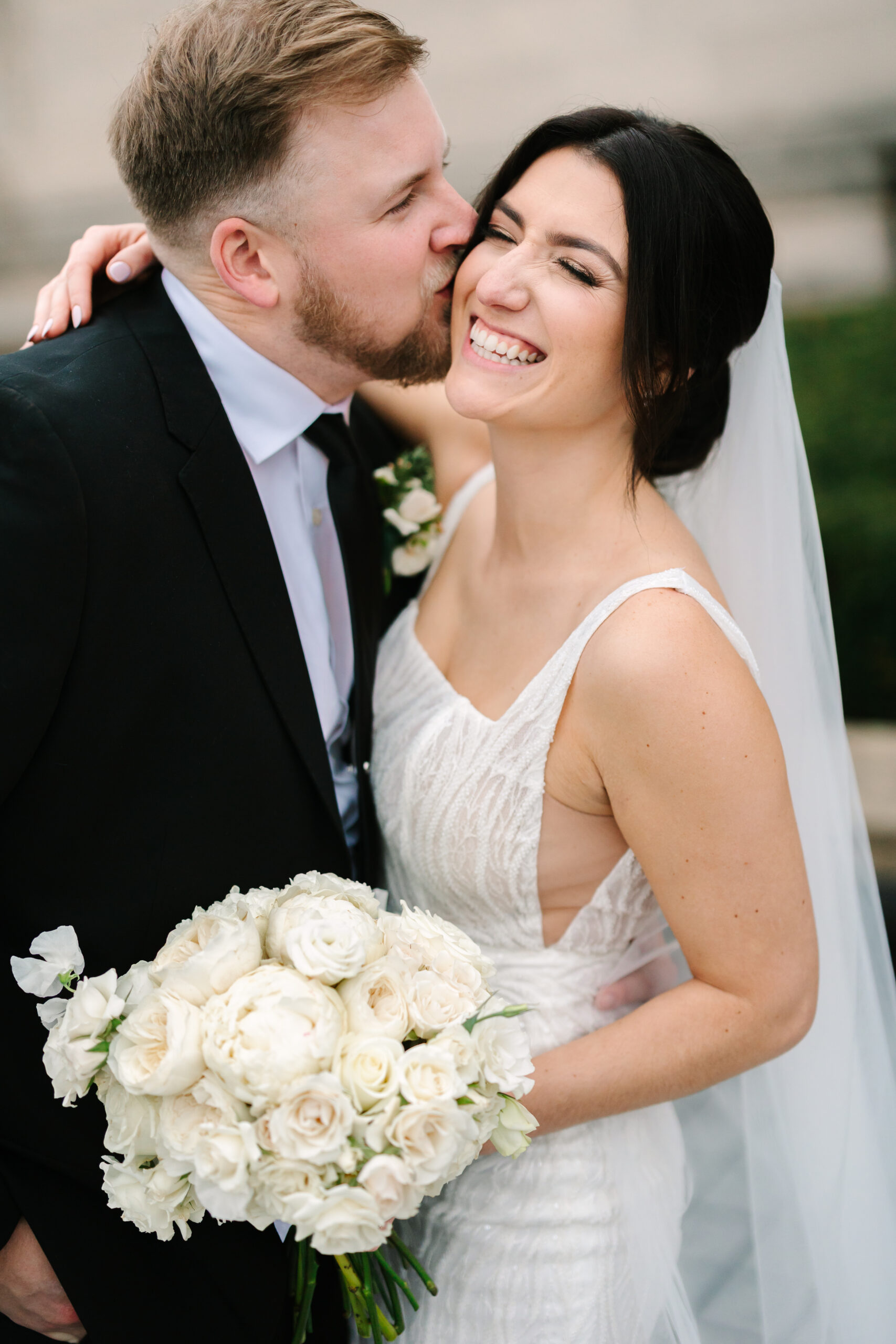 Newlyweds snuggle for wedding photographer in St Louis